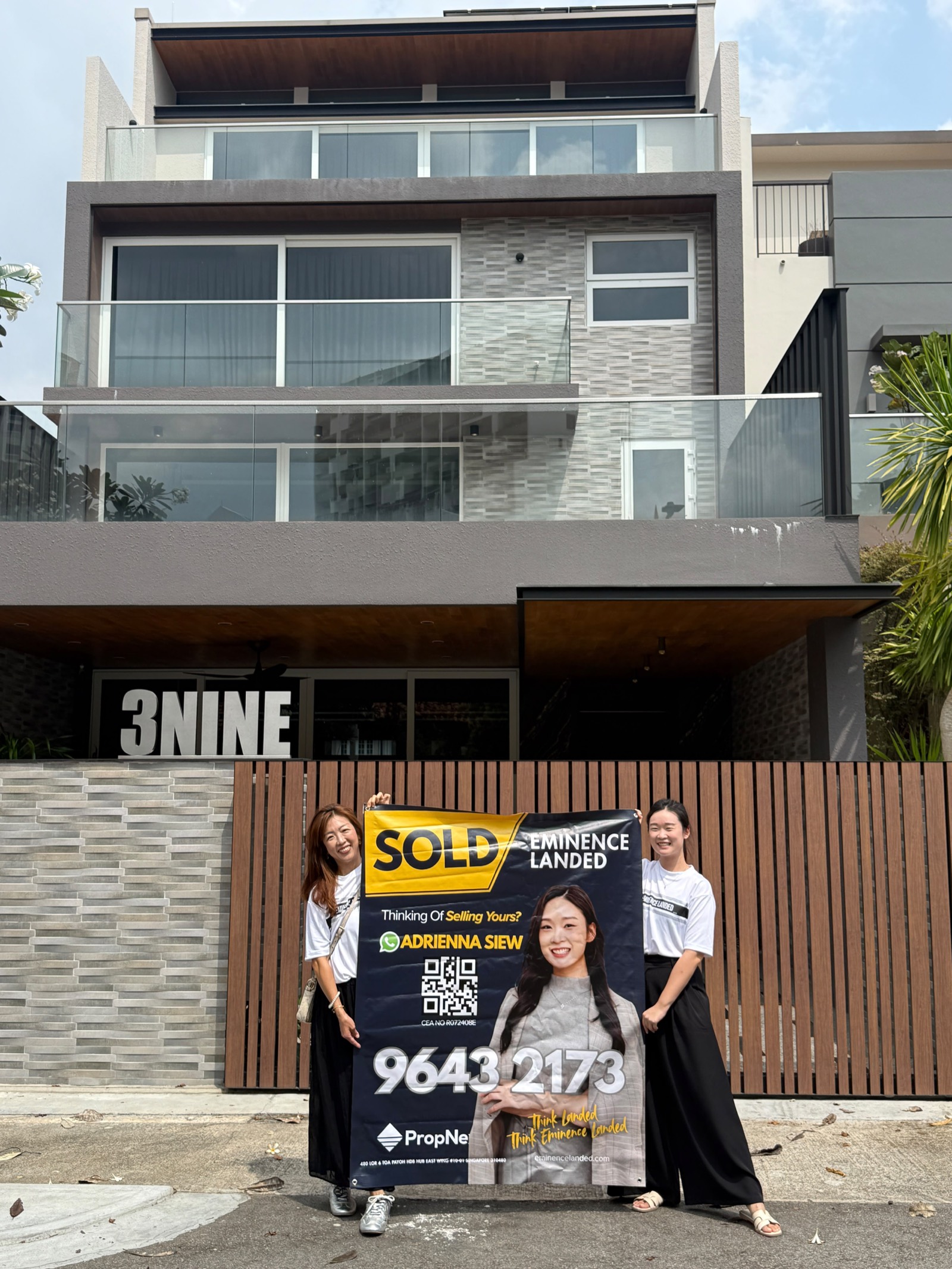 Adrienna Siew with a SOLD banner at a Singapore landed property handover